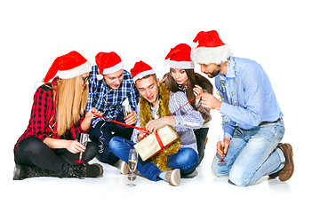 Image showing Many young women and men drinking at christmas party