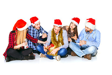 Image showing Many young women and men drinking at christmas party