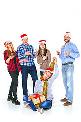 Image showing Many young women and men drinking at christmas party