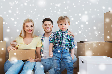 Image showing happy family with boxes moving to new home