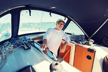 Image showing happy senior man on boat or yacht sailing in sea