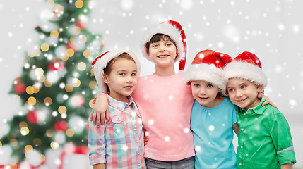 Image showing happy little children in christmas santa hats