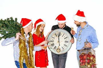 Image showing Many young women and men drinking at christmas party