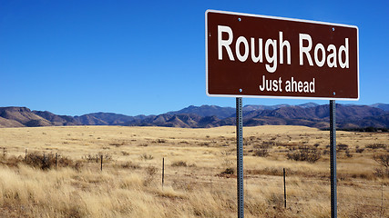 Image showing Rough Road brown road sign