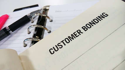 Image showing Customer bonding printed on white book