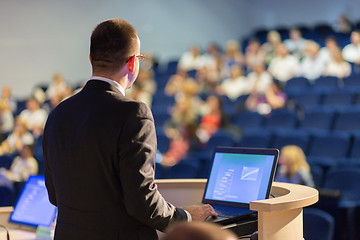 Image showing Public speaker giving talk at business event.