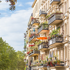 Image showing Traditional European Balcony with colorful flowers and flowerpots.