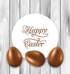 Image showing Celebration card with Easter chocolate eggs on wooden grey backg