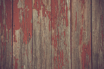 Image showing Red paint pealing off wooden planks