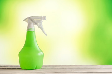 Image showing Spray can on a wooden table