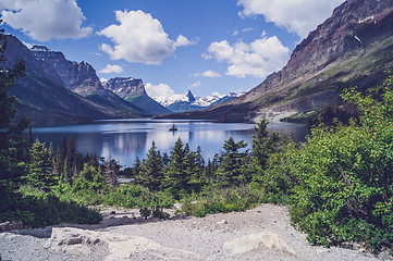 Image showing Lake surrounded by mountains