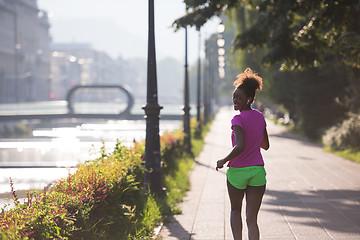 Image showing african american woman jogging in the city