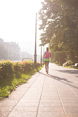 Image showing african american woman jogging in the city