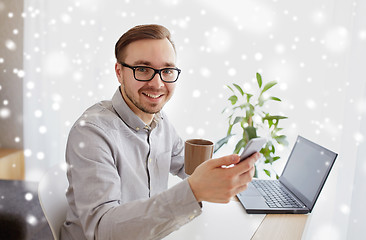 Image showing happy businessman with smarphone and coffee