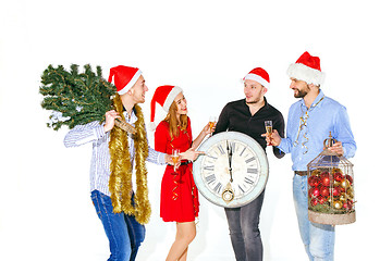 Image showing Many young women and men drinking at christmas party