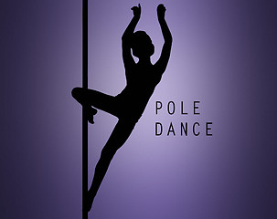 Image showing The silhouette of young girl performing on pylon