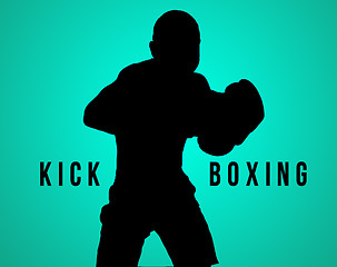 Image showing The silhouette of young man kickboxing on black