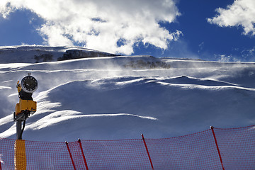 Image showing Off-piste slope during blizzard and sunlight blue sky with cloud