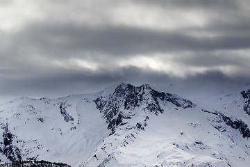 Image showing Snow mountains in haze and storm clouds before blizzard