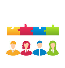 Image showing team of business people with jigsaw puzzle pieces as a solution 