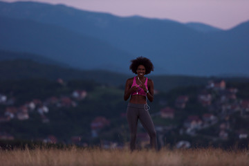 Image showing Young African american woman jogging in nature