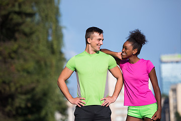 Image showing portrait of young multietnic jogging couple ready to run