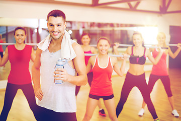 Image showing smiling trainer in front of group of people