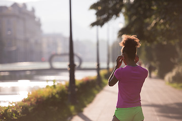 Image showing portrait of young african american jogging woman