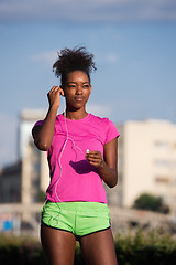 Image showing young african american woman running outdoors