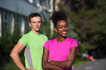 Image showing portrait of young multietnic jogging couple ready to run