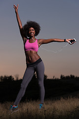 Image showing black woman is doing stretching exercise relaxing and warm up