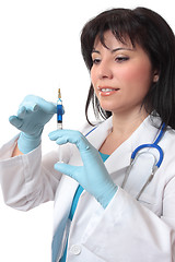 Image showing Female doctor preparing syringe