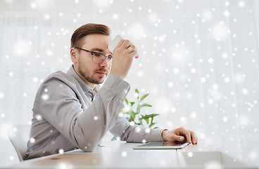 Image showing businessman with smarphone at office