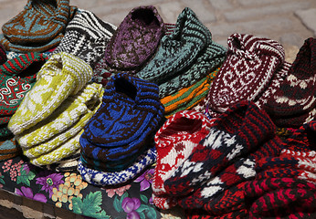 Image showing Knitted slippers in a street market, Uzbekistan