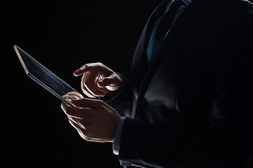 Image showing close up of businessman with transparent tablet pc