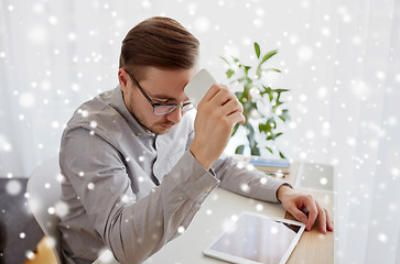 Image showing businessman with smarphone at home office