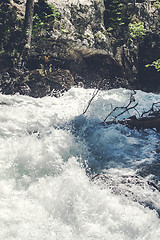 Image showing Splashing water in a wild river stream