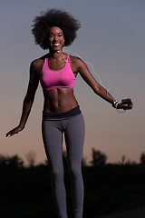 Image showing black woman is doing stretching exercise relaxing and warm up