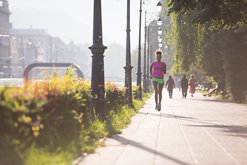 Image showing african american woman jogging in the city