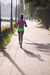 Image showing african american woman jogging in the city