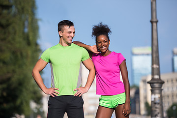 Image showing portrait of young multietnic jogging couple ready to run