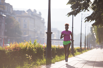 Image showing african american woman jogging in the city