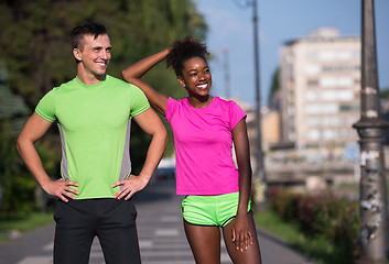 Image showing portrait of young multietnic jogging couple ready to run