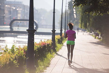 Image showing african american woman jogging in the city