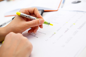 Image showing Table girl work with accounting records