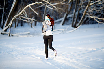 Image showing Girl on jogging in winter