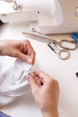 Image showing Woman works with white cloth