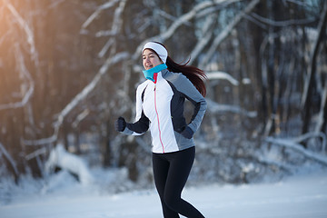 Image showing Girl on jog among forest