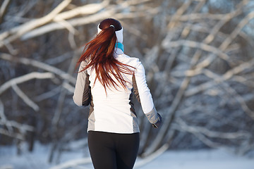 Image showing Young girl engaged in running