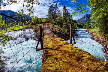 Image showing Suspension bridge over the mountain river, Norway.